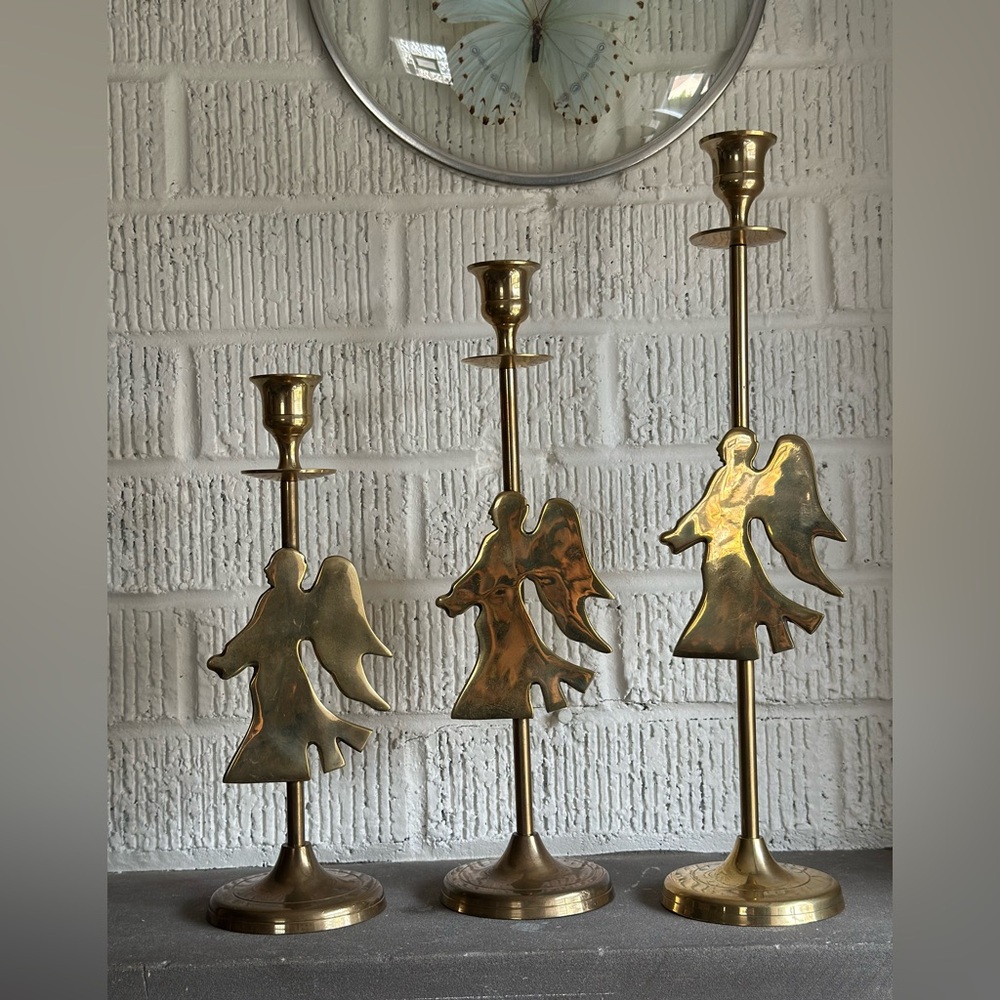 Vintage brass candlesticks with angel accent trio. Range from 9.5”-13.5”